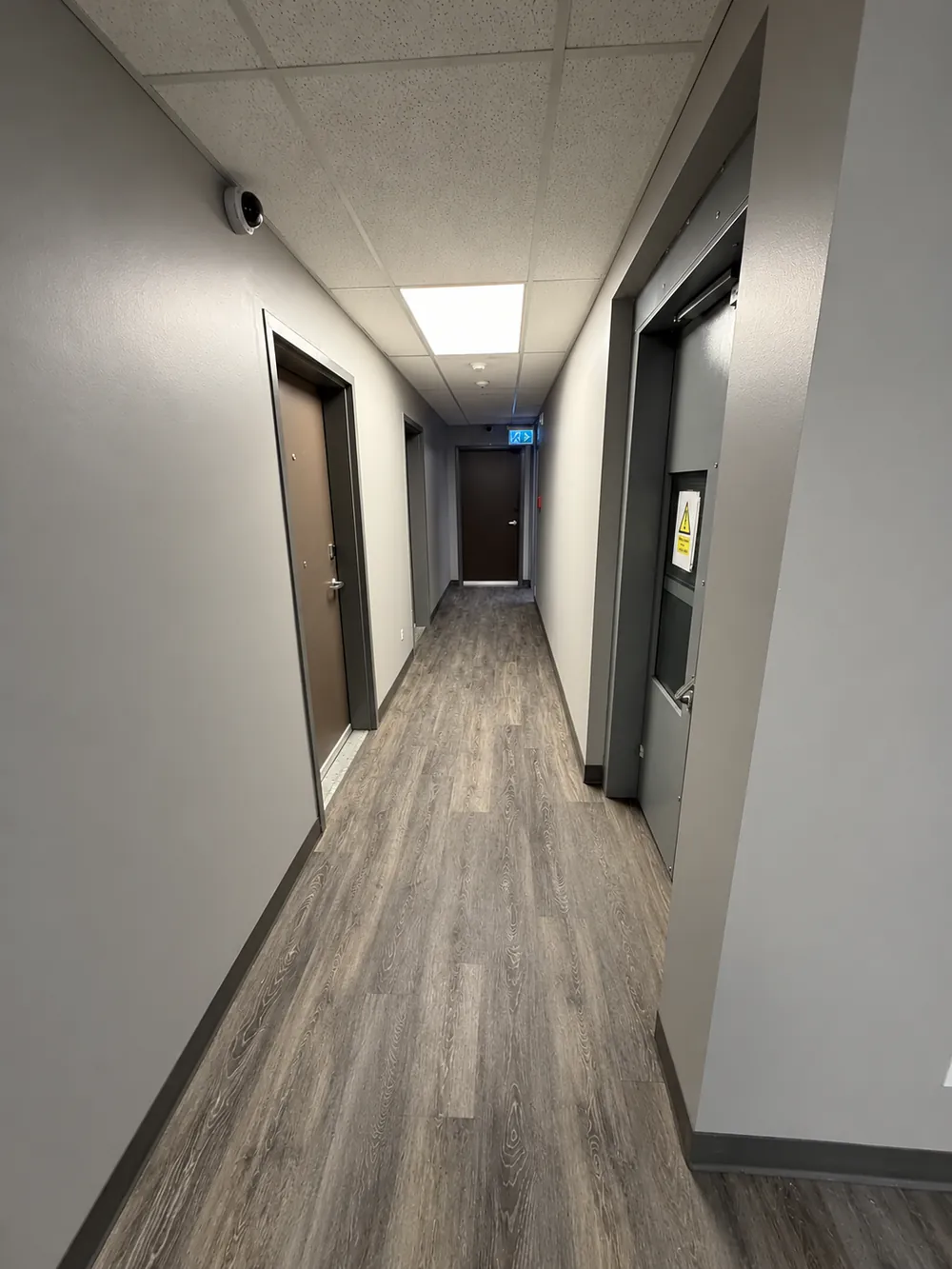 Finished corridor with new flooring, paint and doors