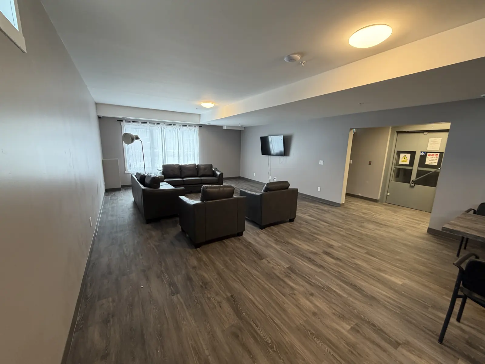 Finished resident lounge with new flooring and lighting
